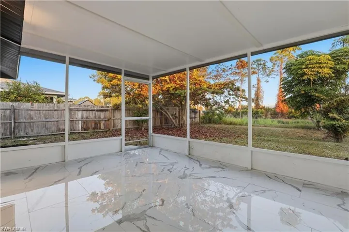 Unfurnished sunroom with plenty of natural light