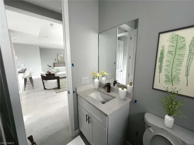 Bathroom featuring vanity and toilet