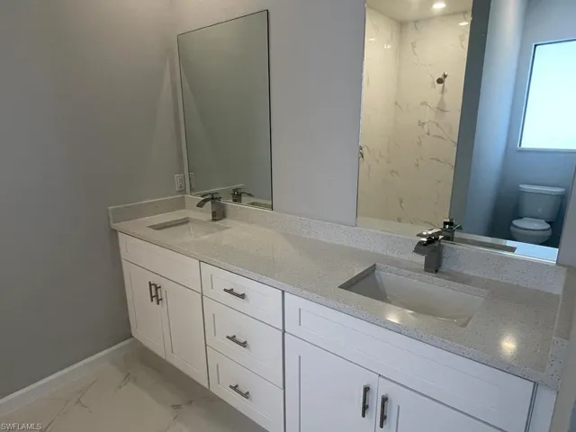 Primary Bathroom with vanity and toilet
