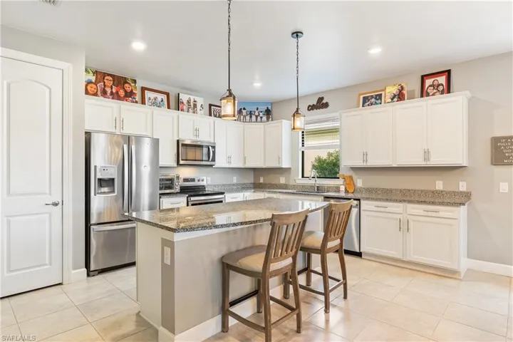 Spacious Kitchen with Stainless Steel Appliances and Pantry