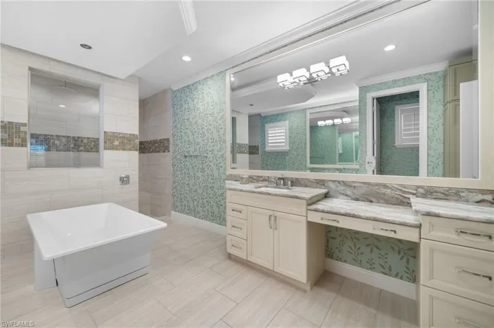 Upgraded casement mirrors and designer wallpaper