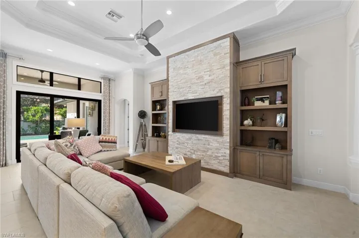 Custom entertainment wall with soaring ceiling and optional transom windows