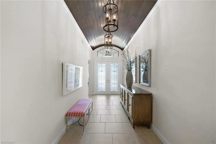 Wood planked barrel ceiling in foyer