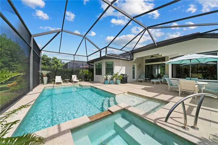 Saltwater pool and spa with upgraded shell stone pavers