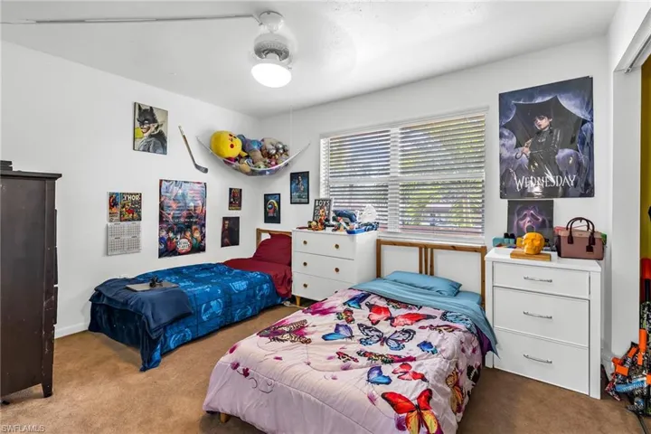 Bedroom featuring carpet flooring and a ceiling fan