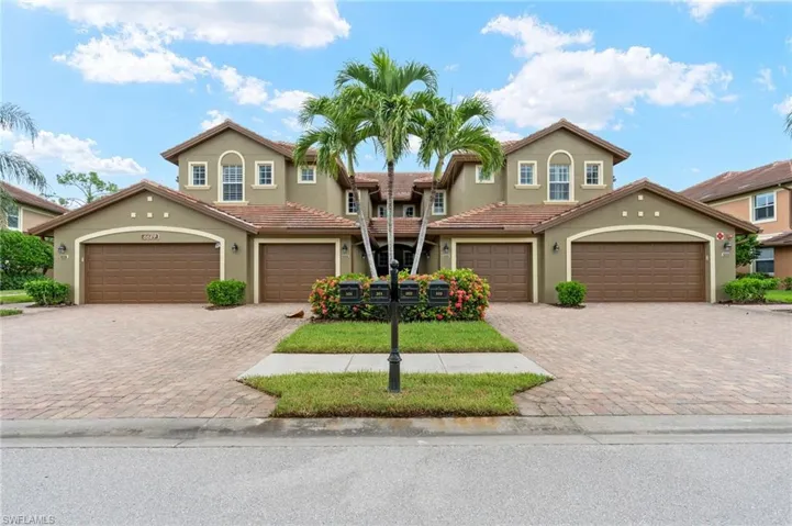View of front of property with stucco siding and driveway