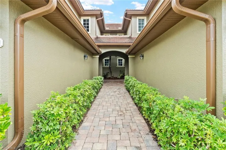 Doorway to property with stucco siding
