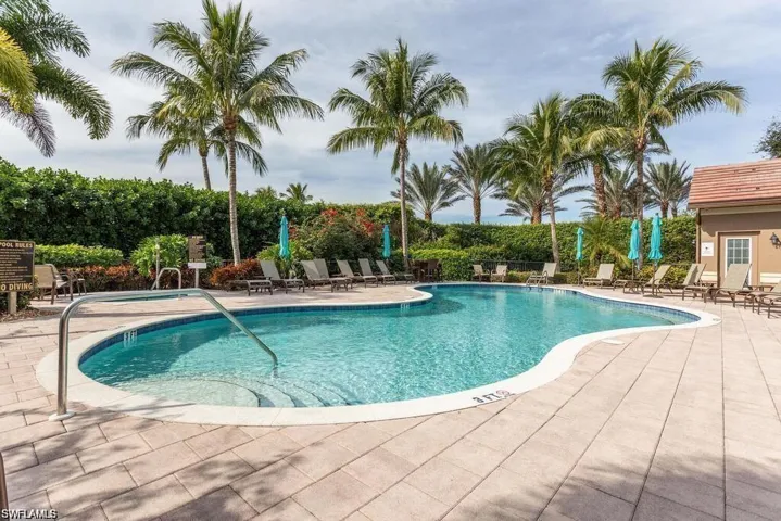Community pool with a patio area