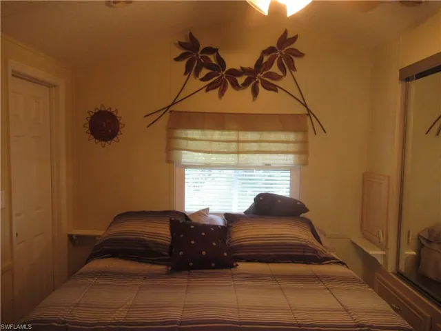 Bedroom featuring lofted ceiling