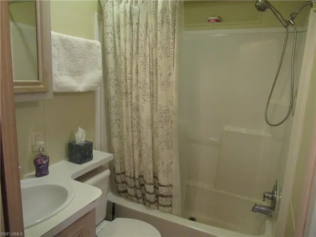 Full bath featuring vanity and shower/ tub combo