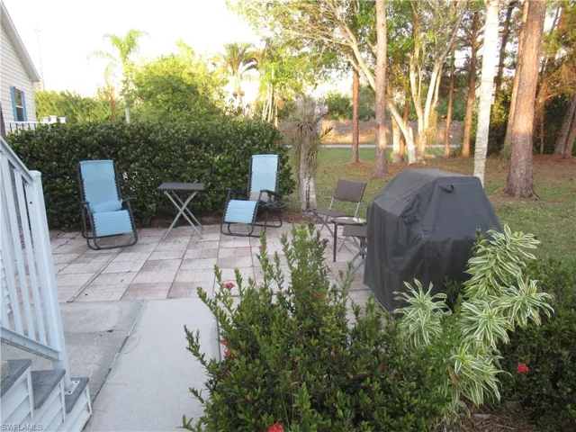View of patio featuring area for grilling