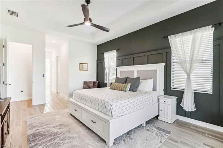 Bedroom featuring light hardwood / wood-style flooring and ceiling fan