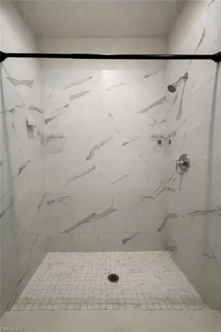 Full bath with tiled shower