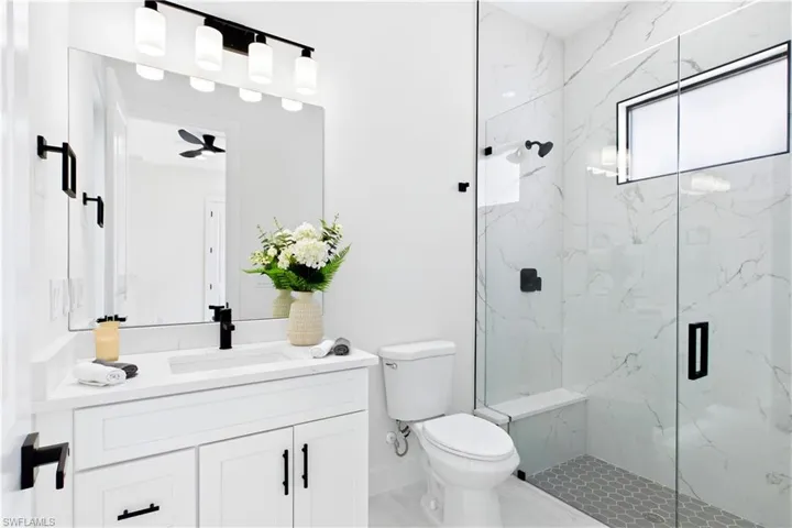 Convenient POOL BATH ACCESS makes indoor-outdoor living effortless for guests & poolside days!