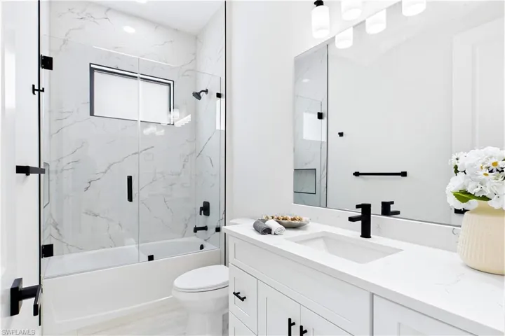 STYLISH HALL BATHROOM makes everyday routines effortless w/ a bright modern design, QUARTZ vanity & beautifully tiled TUB/SHOWER. Perfectly positioned for FAMILY & GUESTS while maintaining the home’s cohesive CONTEMPORARY STYLE!