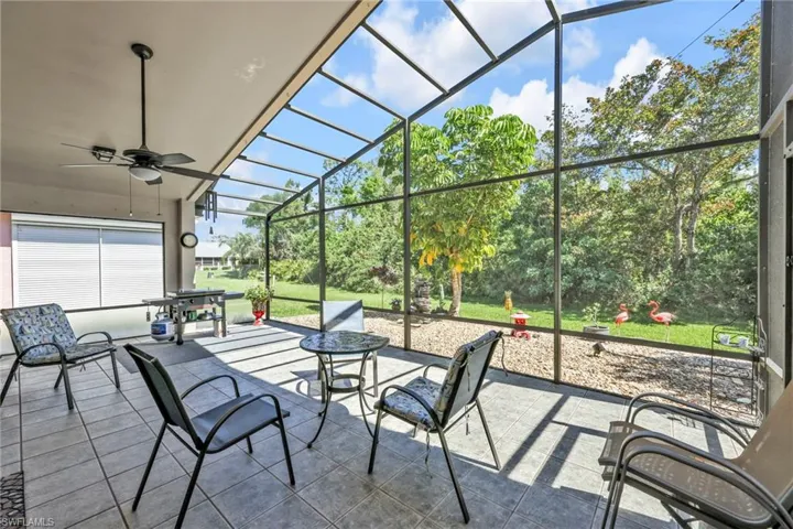 View of patio with new screened enclosure, ceramic tile, and ceiling fan
