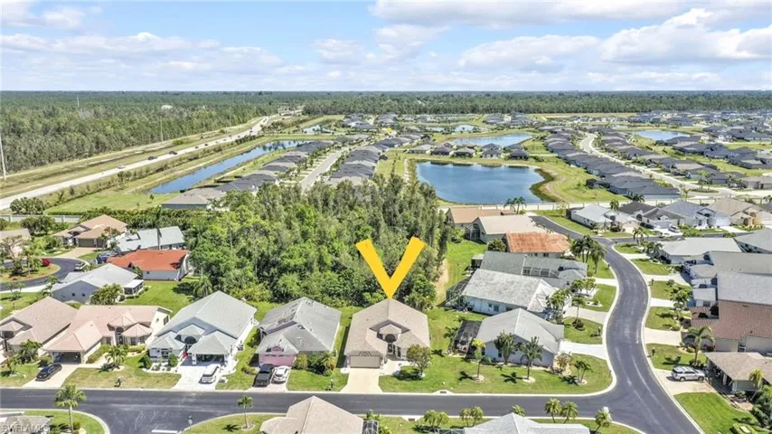 Drone / aerial view with a residential view and a water view