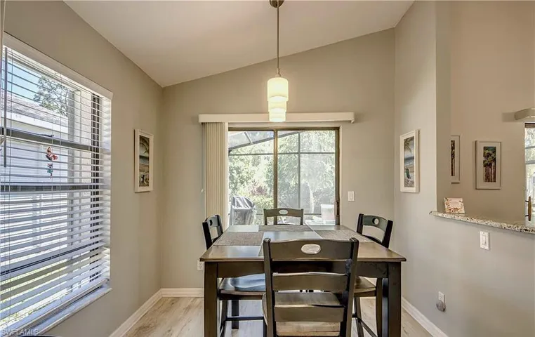 Dining room with lofted ceiling, and great view of the preserve out back