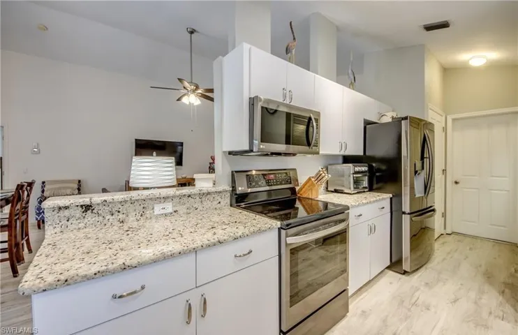 Kitchen updates include drawers inside the cabinets, granite counters, convection oven and 5 burner top