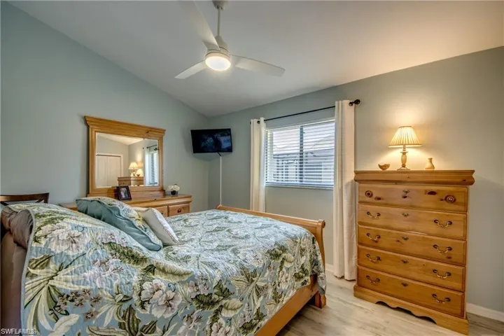 2nd Bedroom with a updated ceiling fan, vaulted ceiling and neutral paint