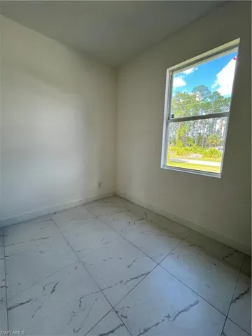 Empty room with light marble finish floors