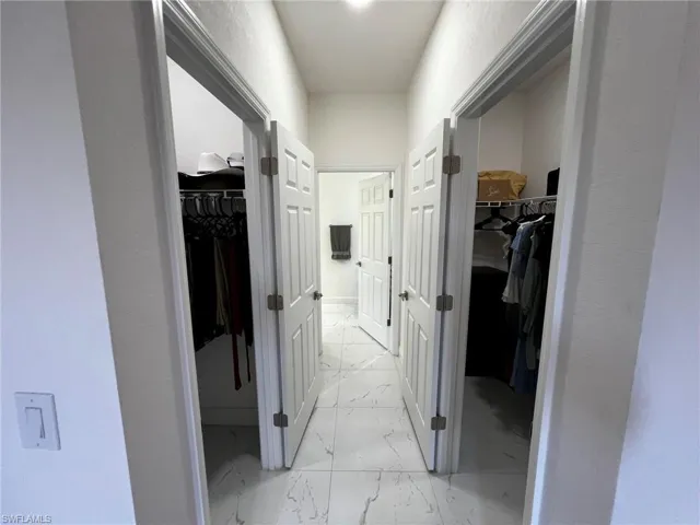 Corridor with marble finish floor