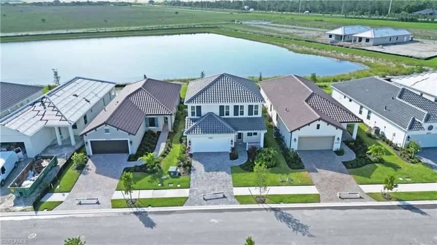 Aerial view of residential area with a nearby body of water
