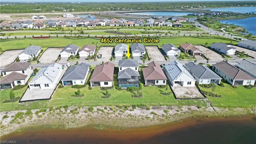 Aerial view of residential area with a nearby body of water