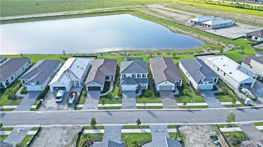 Aerial view of residential area with a large body of water