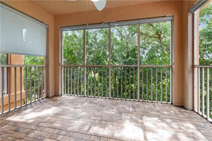 Screened-in balcony with custom blinds