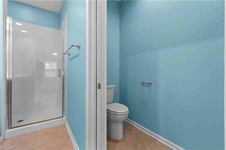 Primary bathroom with walk-in shower and separate water closet