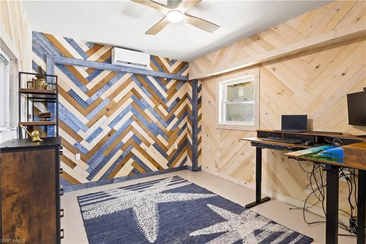 This flexible space, located within the garage, can serve as an office or den and includes its own bathroom. Equipped with two AC splitters, it offers year-round comfort and versatility.