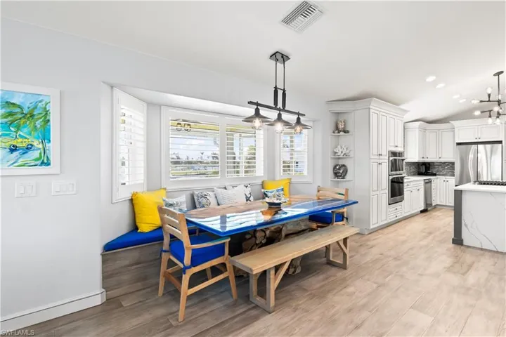 The dining room features a custom driftwood-and-epoxy table, designed to seat ten or more.