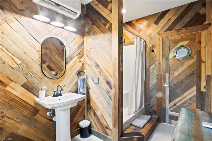A full bathroom accompanies the garage’s versatile flex space.