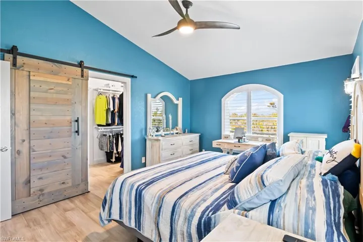 The primary bedroom continues the home's theme of luxury, offering a spacious, serene retreat.