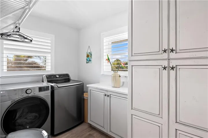 Spacious laundry room with plenty of storage.