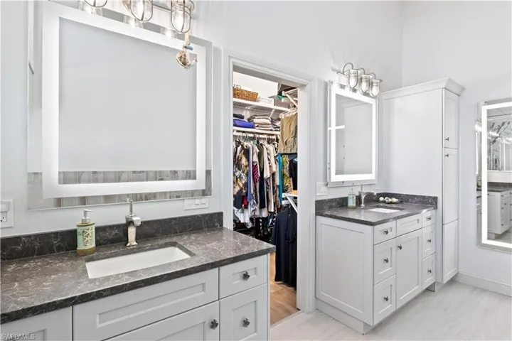 The primary bathroom has it all - dual vanities and more!