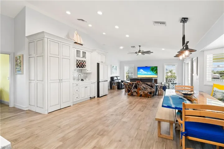 Vaulted ceilings and abundant natural light enhance the bright and open floorplan.
