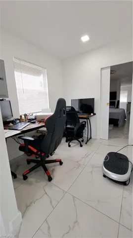 Office featuring light marble finish flooring