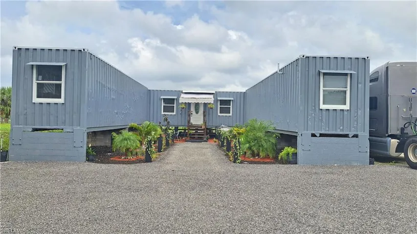 View of front of house with board and batten siding