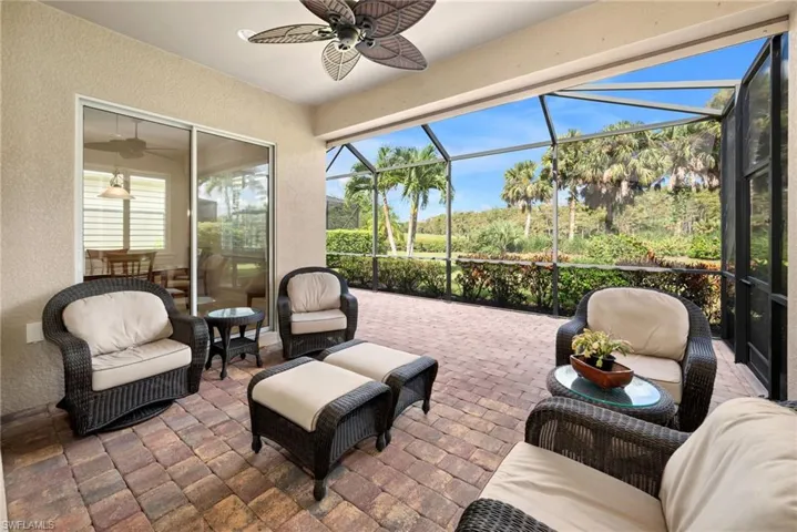 Sunroom with ceiling fan and a wealth of natural light