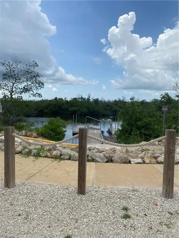 Water view with a dock and a boat ramp