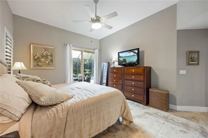 Bedroom with access to outside and a ceiling fan