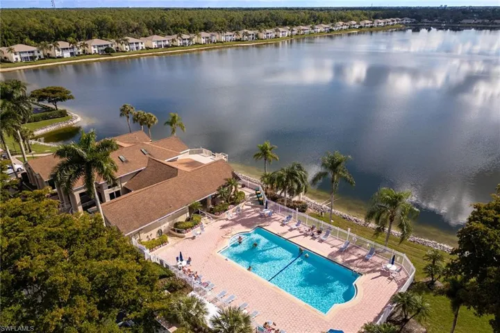 Aerial perspective of suburban area featuring a large body of water