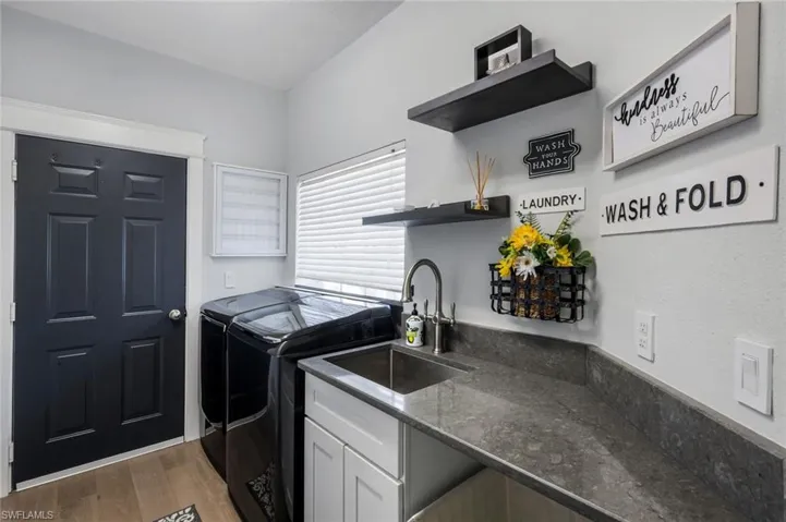 Washer, dryer, Laundry sink & folding area.