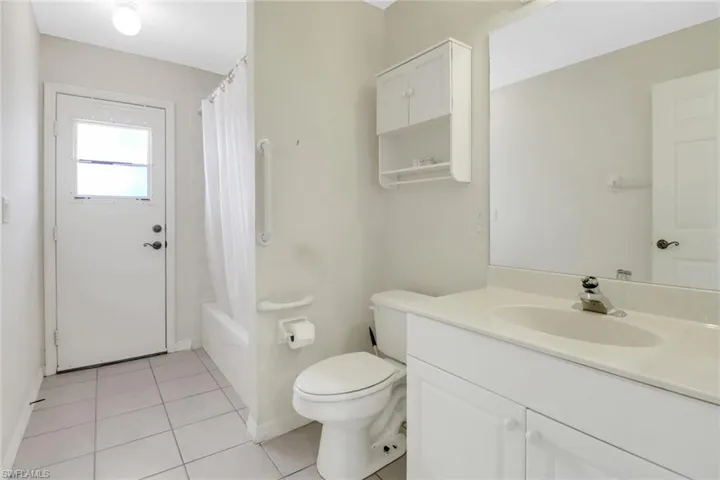 Guest bath doubles as the pool bathroom