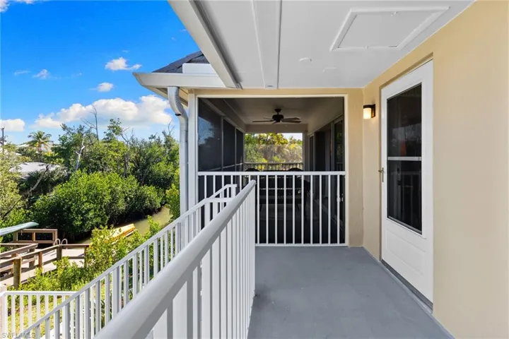 Balcony featuring a ceiling fan