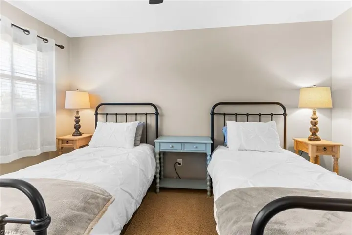 Bedroom with carpet floors and a ceiling fan