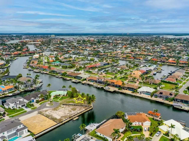 Drone / aerial view featuring a water view and a residential view