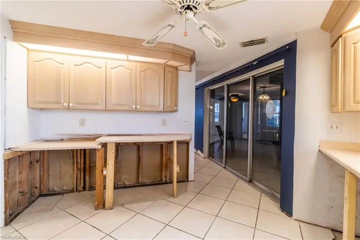 Kitchen featuring light brown cabinetry and light tile patterned floors